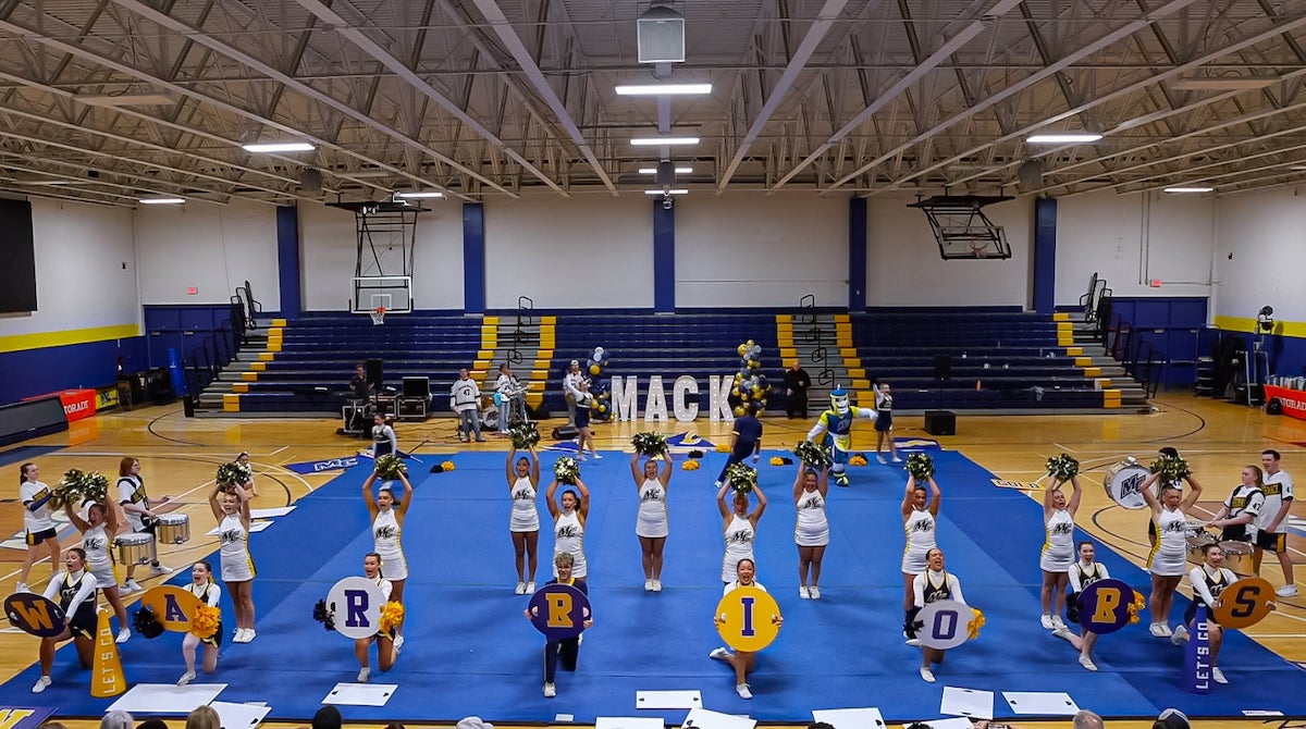 Photo of ϲʿ cheerleaders posing mid-routine.